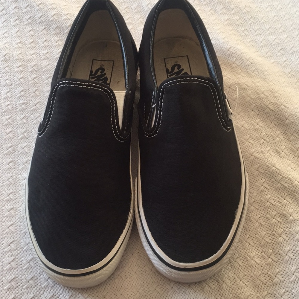 Black slip on Vans. Only worn once!